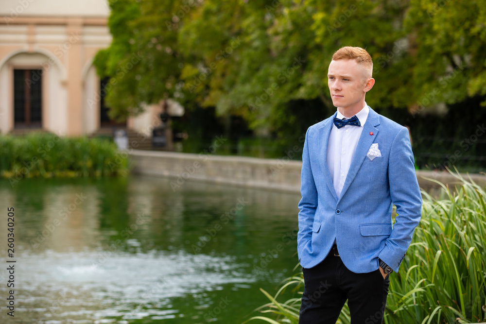 Charming groom in Wallenstein garden in Prague, Czech Republic Charming groom in Wallenstein garden in Prague, Czech Republic