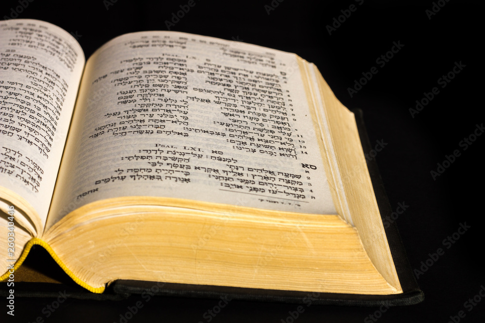 Open hebrew Bible, isolated on black background, with front lighting Open hebrew Bible, isolated on black background, with front lighting