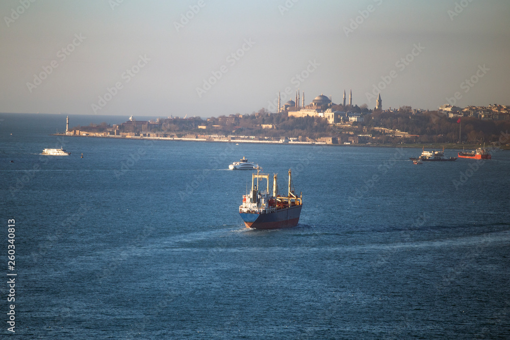 Aerial view of a ship passing by Yavuz Sultan Selim Bridge and Bosphorus