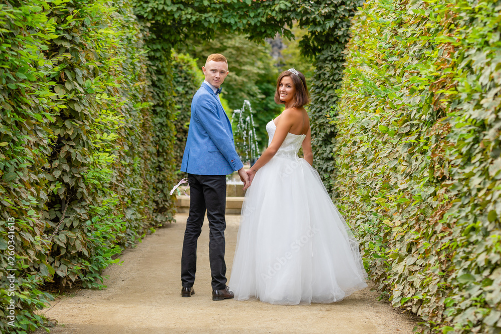 Charming newlywed couple in Wallenstein garden in Prague, Czech Republic Charming newlywed couple in Wallenstein garden in Prague, Czech Republic