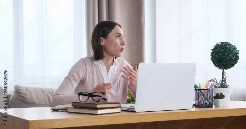 Businesswoman using laptop for video conferencing Businesswoman using laptop for video conferencing