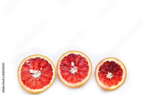 Orange red sweet ripe juicy sliced on a white background. Tropical fruit.   opy space.Flat lay  top view.