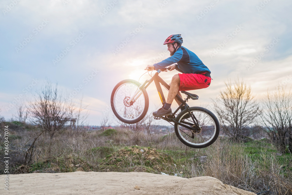 Cyclist on a mountain bike performing a jump. Active lifestyle. Cyclist on a mountain bike performing a jump. Active lifestyle.