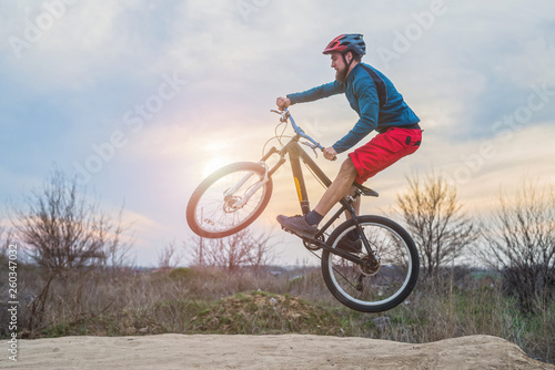 Biker on a mountain bike performing a jump. Active lifestyle.