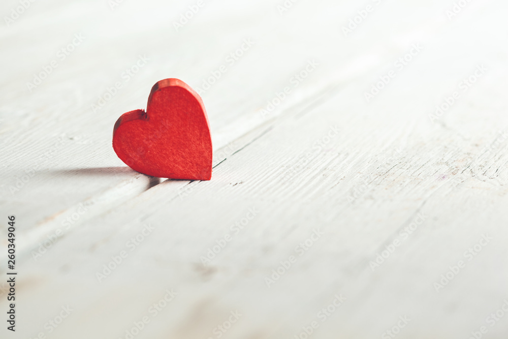 Fototapeta premium red heart on the wooden desk