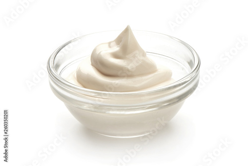 Bowl of Sour Cream or mayonnaise, close-up, isolated on white background