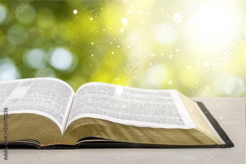 Holy Bible book on a wooden background