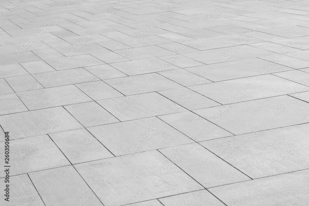 Paving stones background. Road texture black and white. Stone flooring. Stone covering on the square.