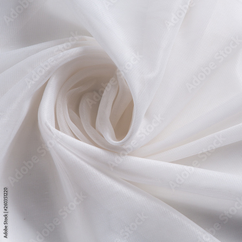 white thin fabric for curtains, tulle or organza, pleats photo
