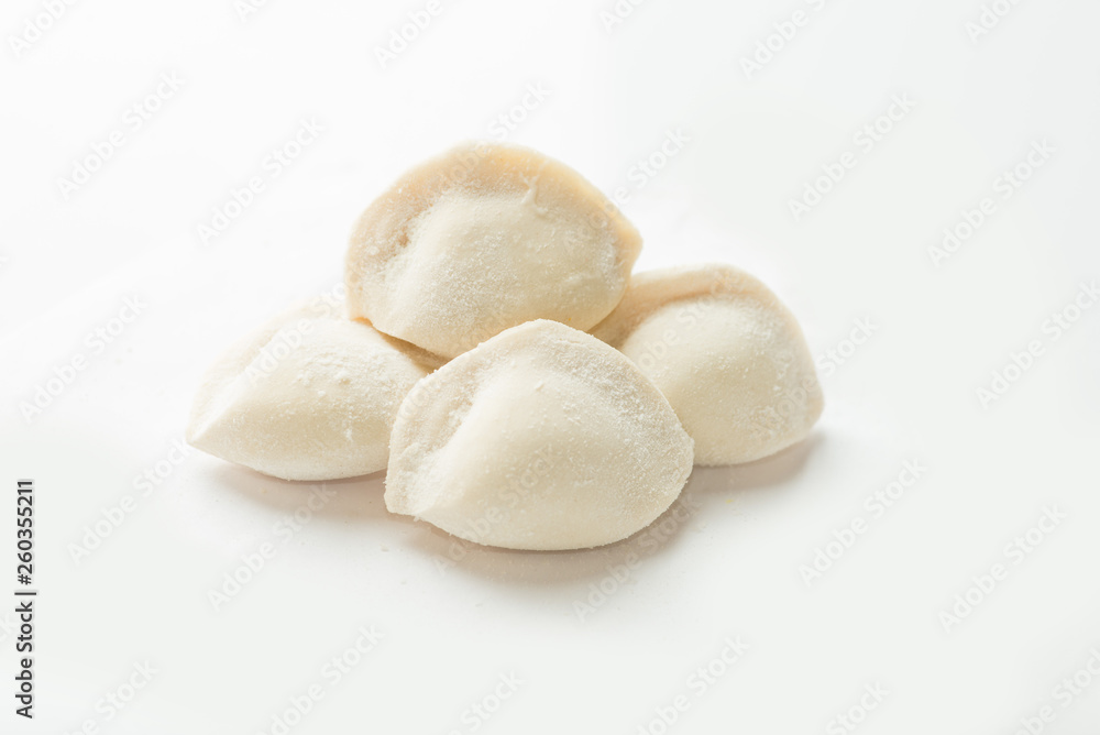 four frozen dumplings on a white background. Isolated Dumplings four frozen dumplings on a white background. Isolated Dumplings