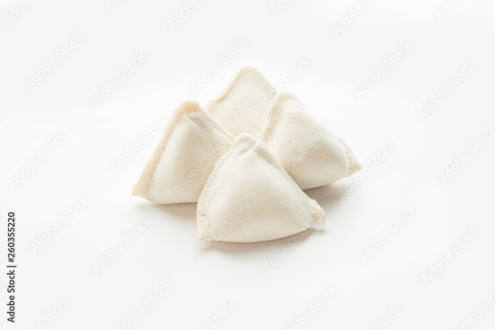 four frozen dumplings on a white background. Isolated Dumplings four frozen dumplings on a white background. Isolated Dumplings