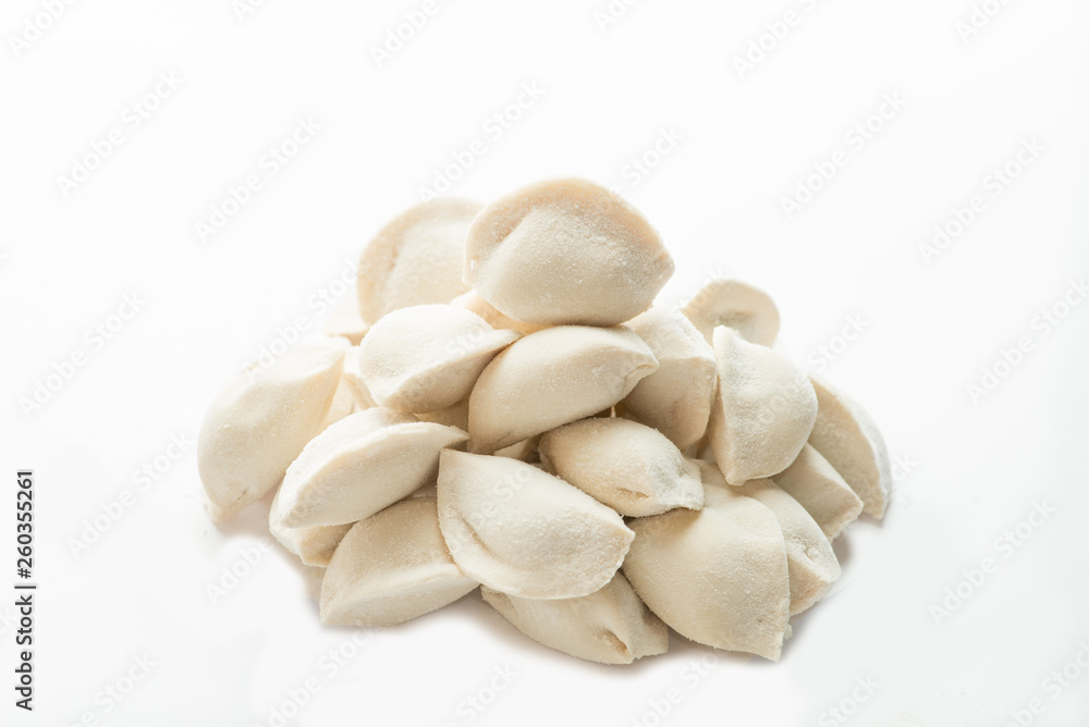 heap of frozen dumplings on a white background. Isolated Dumplings heap of frozen dumplings on a white background. Isolated Dumplings