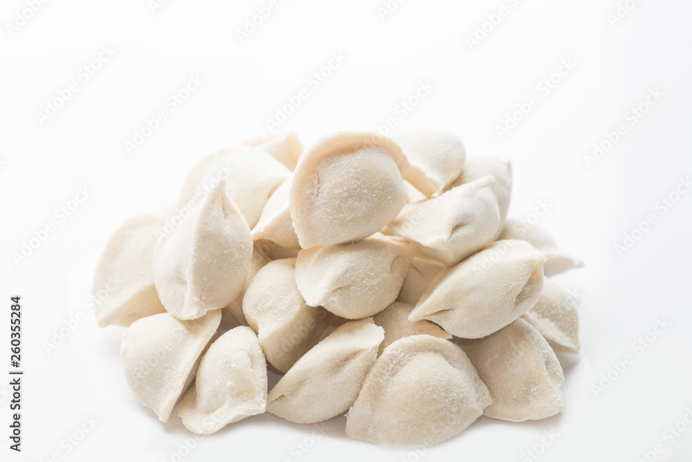 heap of frozen dumplings on a white background. Isolated Dumplings heap of frozen dumplings on a white background. Isolated Dumplings