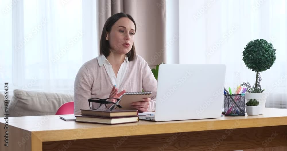 Businesswoman having video conference on laptop Businesswoman having video conference on laptop