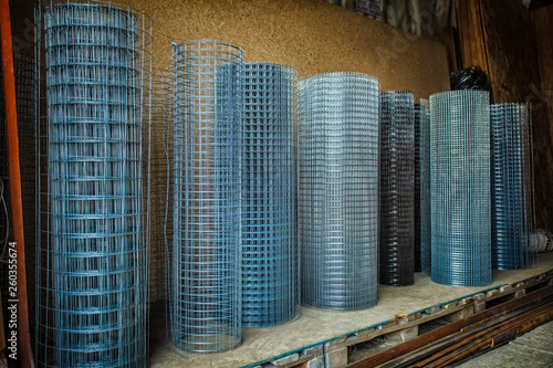 Rolls of iron mesh (wire mesh) use for reinforce concrete in construction site. Metal grid. Grid of pending orders. Metal mesh in rolls.
