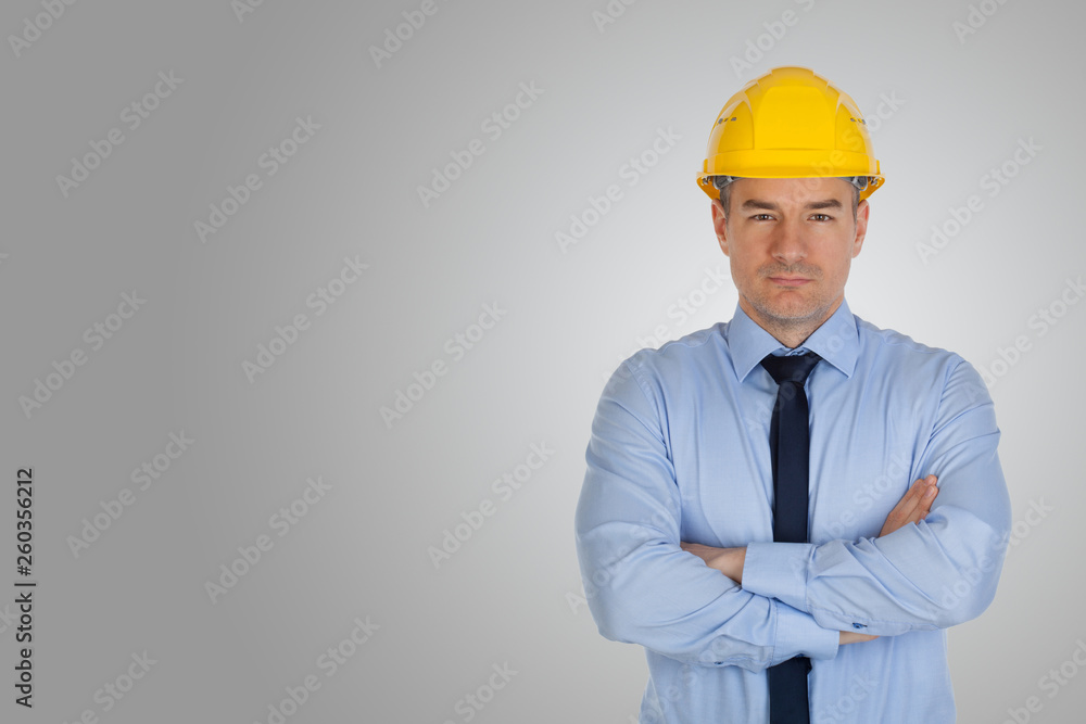 Architect with hands folded on gray background. Architect with hands folded on gray background.