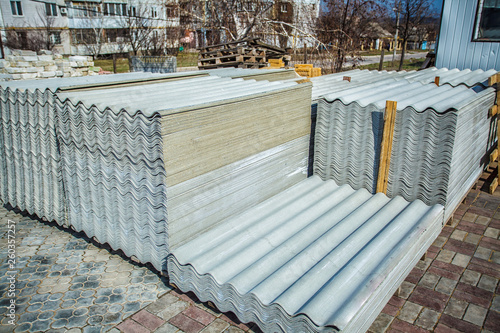 Asbestos roof. Asbestos cement roofing sheets, corrugated panels, stacked.