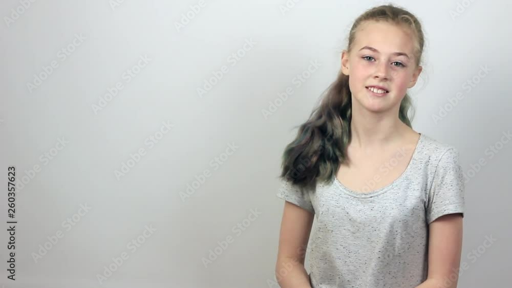Beautiful teenager girl pointing fingers at copy space. Beautiful teenager girl pointing fingers at copy space.