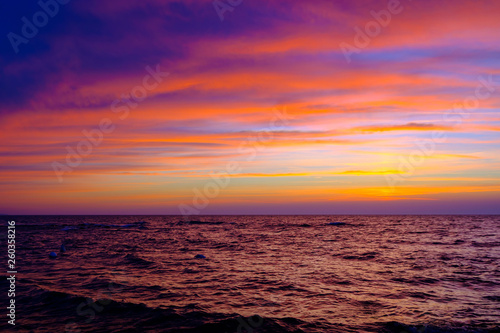 Beautiful sunset at sea side with stones © Anton Gvozdikov