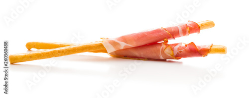Tableau sur toile Parma ham prosciutto with grissini breadsticks.
