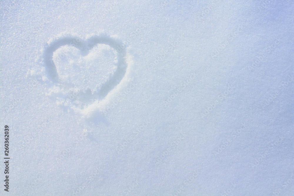 Heart drawn with a finger in the snow. Close-up. Background. Texture. Heart drawn with a finger in the snow. Close-up. Background. Texture.