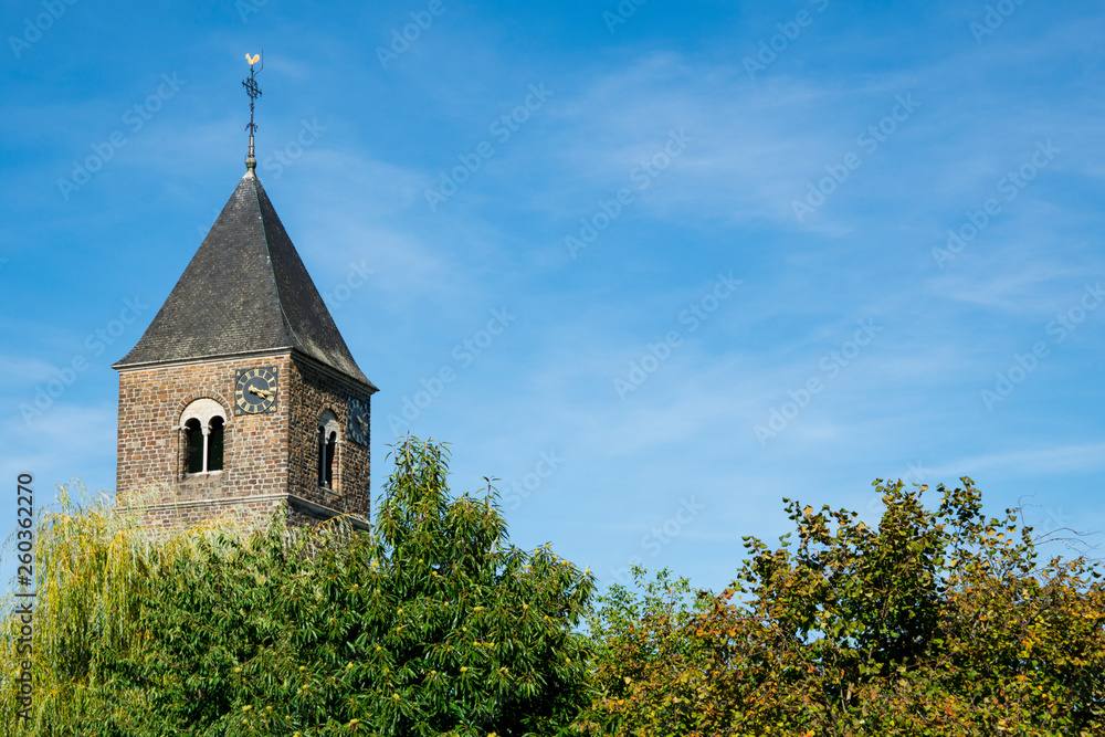 Sint Pancratius Church in Mesch, The Netherlands. Blue sky, space for text