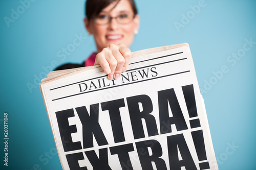Happy Businesswoman Holding Extra! Extra! Newspaper