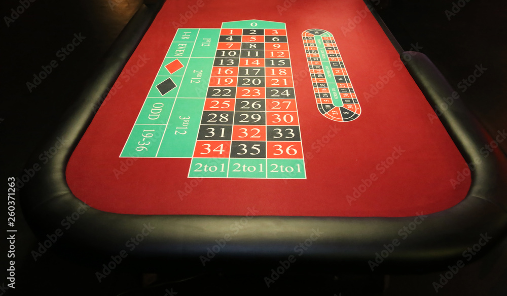 Close-up vibrant image of green casino table on black background Close-up vibrant image of green casino table on black background