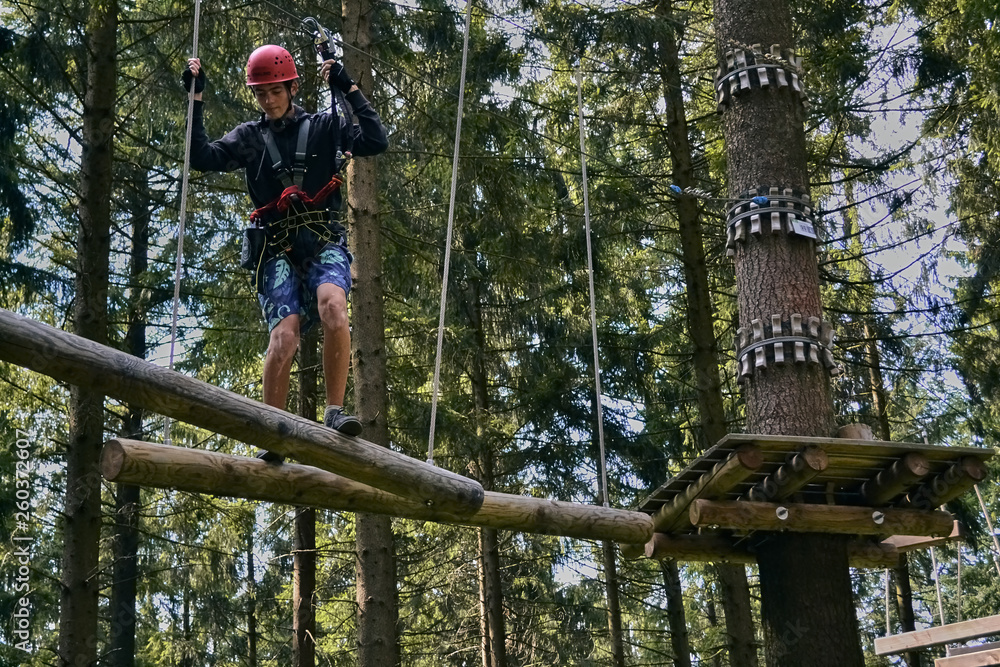 young guy climbing the ropes young guy climbing the ropes