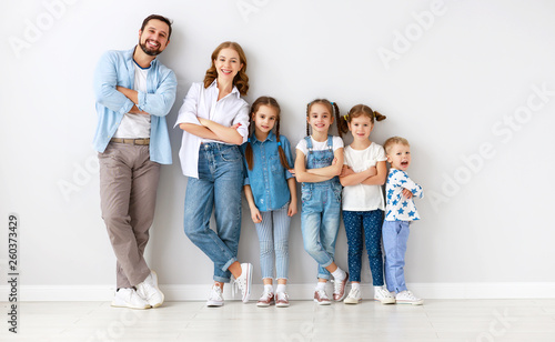 large family mother father and children sons and daughters on white background