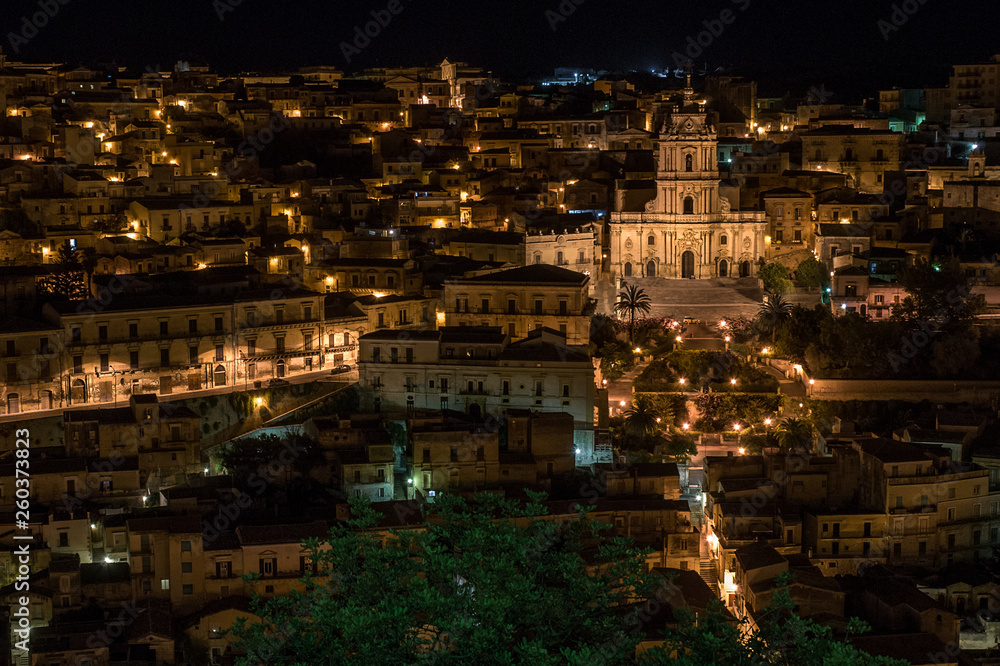 Night view over the village of Modica in the south of Sicily, Italy