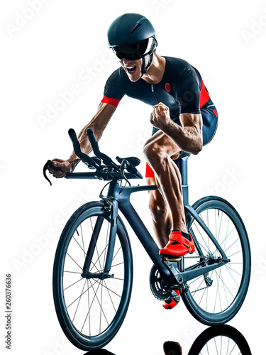 triathlete triathlon Cyclist cycling in studio silhouette shadow isolated on white background © snaptitude