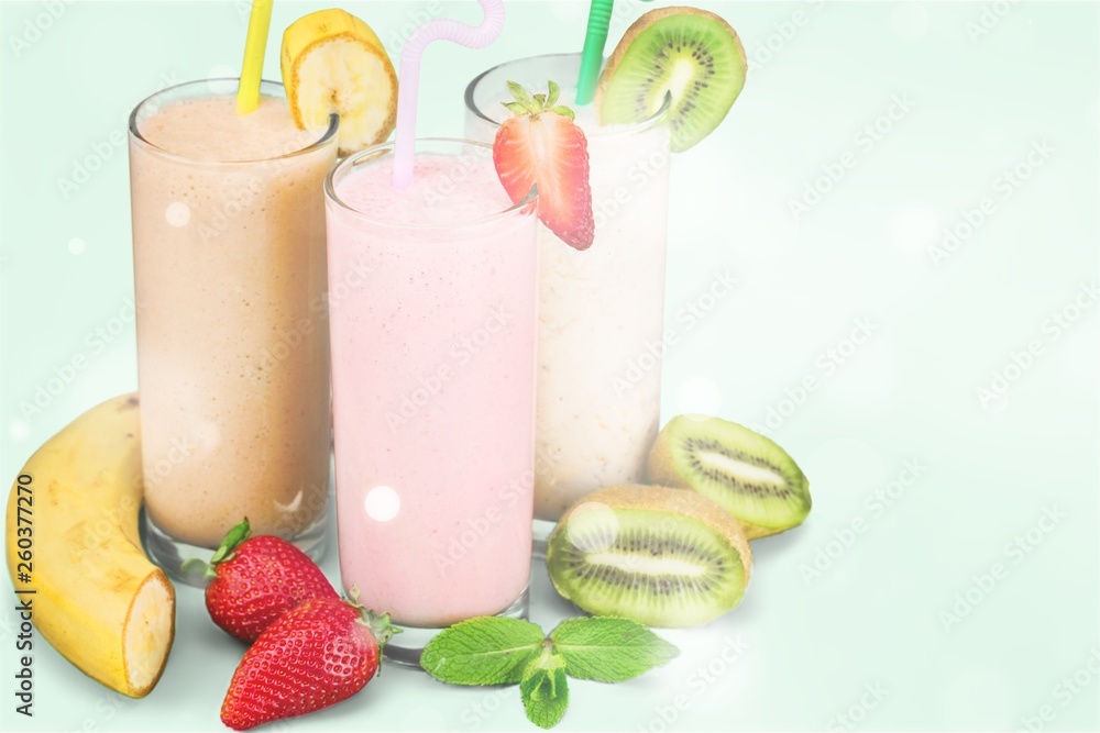 Fruit Smoothies with Straws Isolated on a White Background Fruit Smoothies with Straws Isolated on a White Background