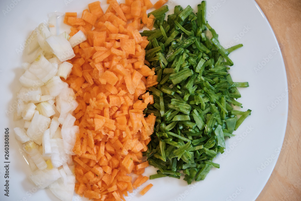 Chopped Onions, Carrots and Beans on a Plate Chopped Onions, Carrots and Beans on a Plate