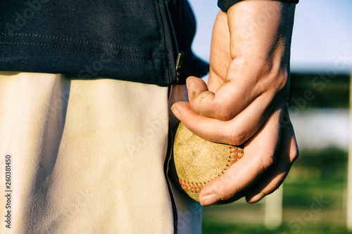 Sticker Pitcher holds baseball in hand to throw
