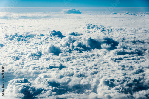 Top view of white clouds above the ground or water © Алексей Еремеев