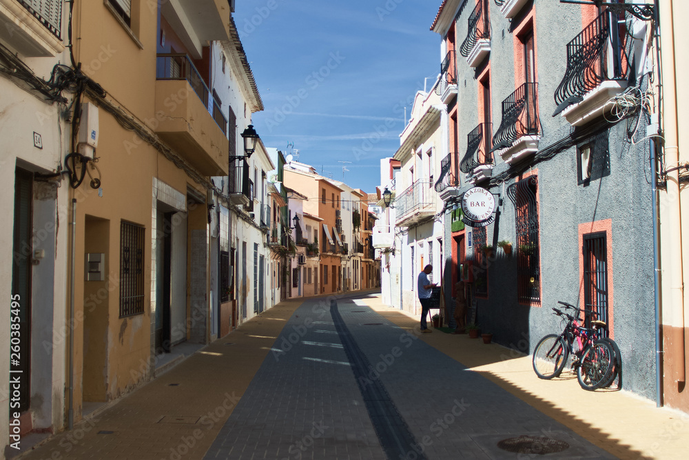 DENIA, SPAIN - OCTOBER 7, 2018: Narrow Spanish street in the old town of Denia