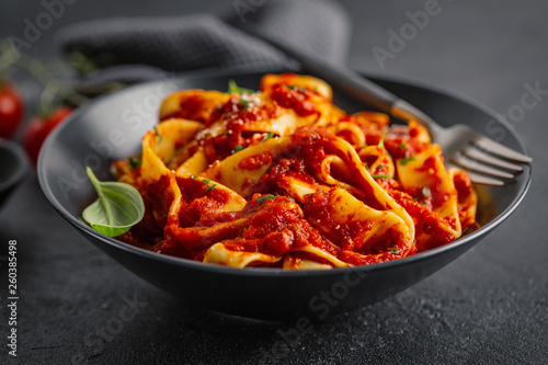 Italian spaghetti with tomato sauce served on plate