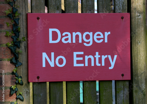 Danger No Entry Sign on an Old Perimeter Gate
