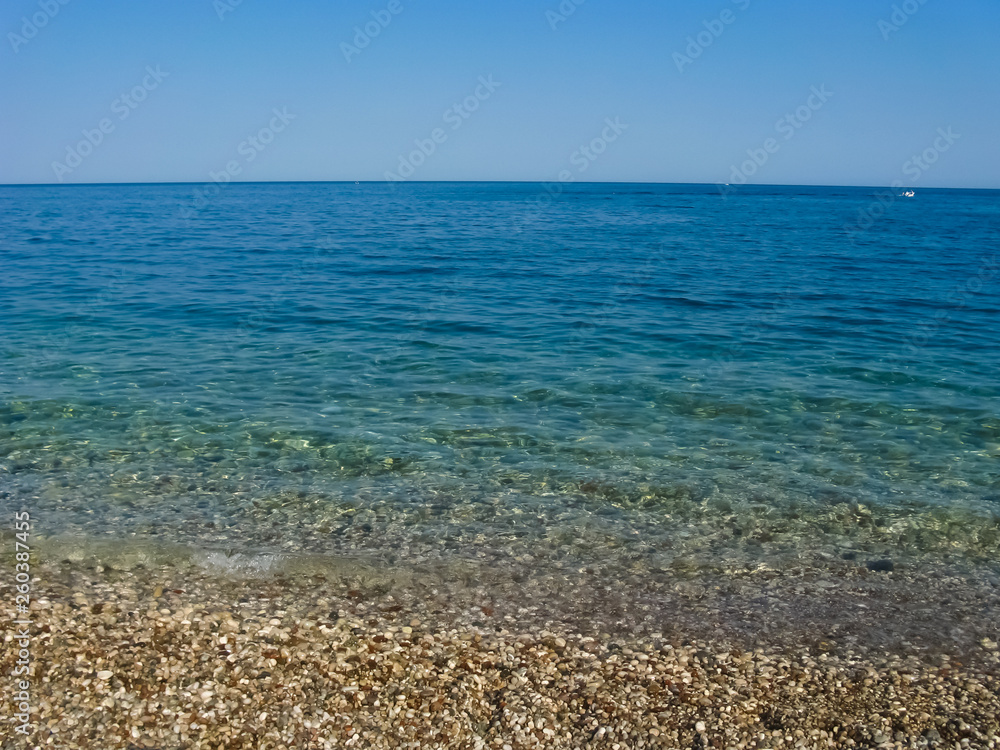 Calm sea without waves. Horizon at sea. Turkey, the Mediterranean Sea. Calm sea without waves. Horizon at sea. Turkey, the Mediterranean Sea.