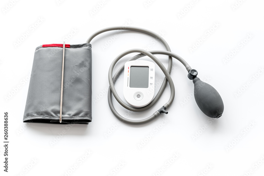 pulsimeter on the desk of the doctor for diagnostics of cardiac disease on white background top view space for text pulsimeter on the desk of the doctor for diagnostics of cardiac disease on white background top view space for text