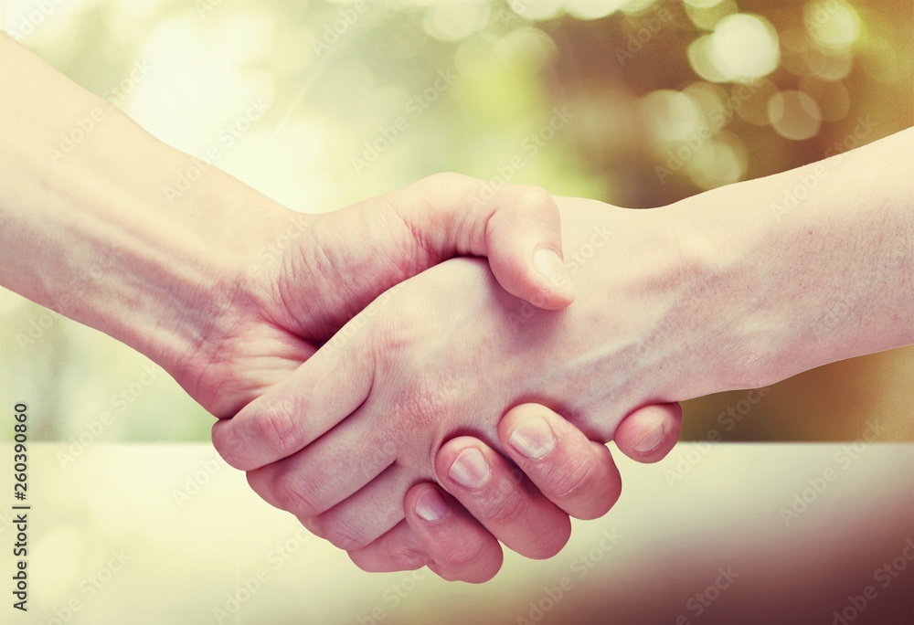 Hands of the old man and a young woman. close up. Hands of the old man and a young woman. close up.