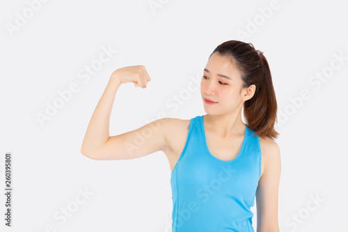 Beautiful portrait young asian woman wear sport clothes have strong and muscle with health, girl show biceps with exercise and workout for wellness isolated white background, strength and fit concept.