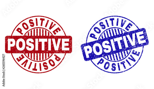 Grunge POSITIVE round stamp seals isolated on a white background. Round seals with grunge texture in red and blue colors. Vector rubber watermark of POSITIVE label inside circle form with stripes.