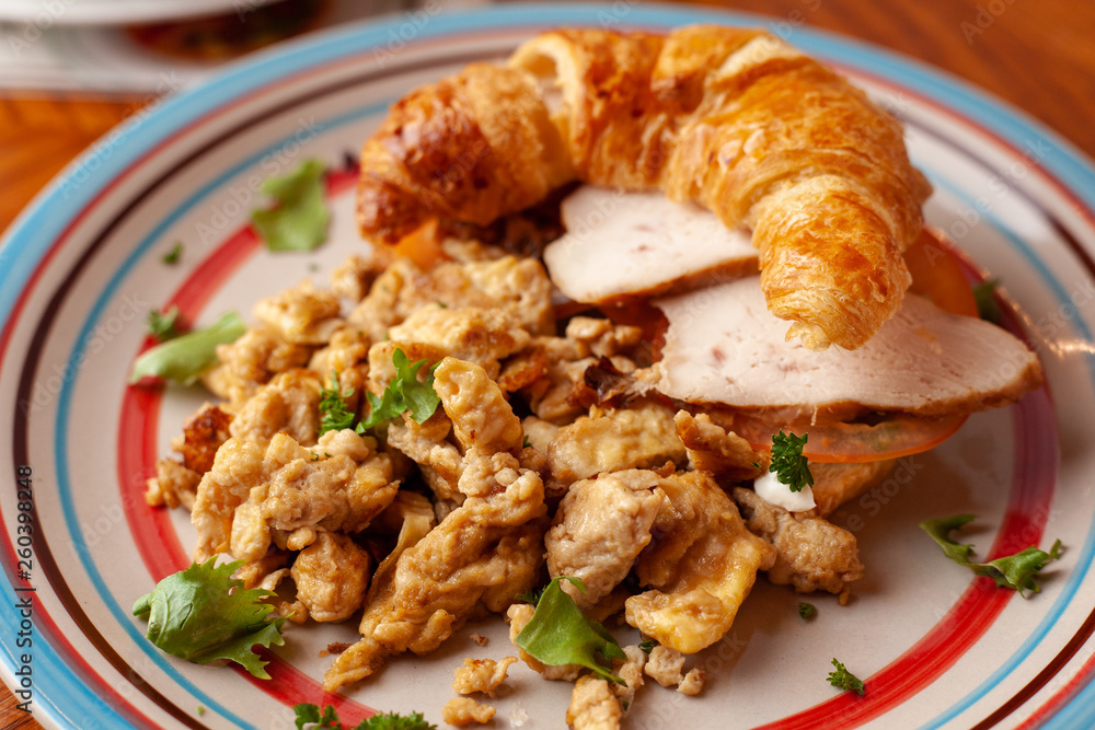 Lush croissant with chicken, soft cream cheese and scramble Lush croissant with chicken, soft cream cheese and scramble