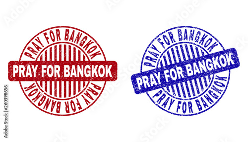 Grunge PRAY FOR BANGKOK round stamp seals isolated on a white background. Round seals with grunge texture in red and blue colors.