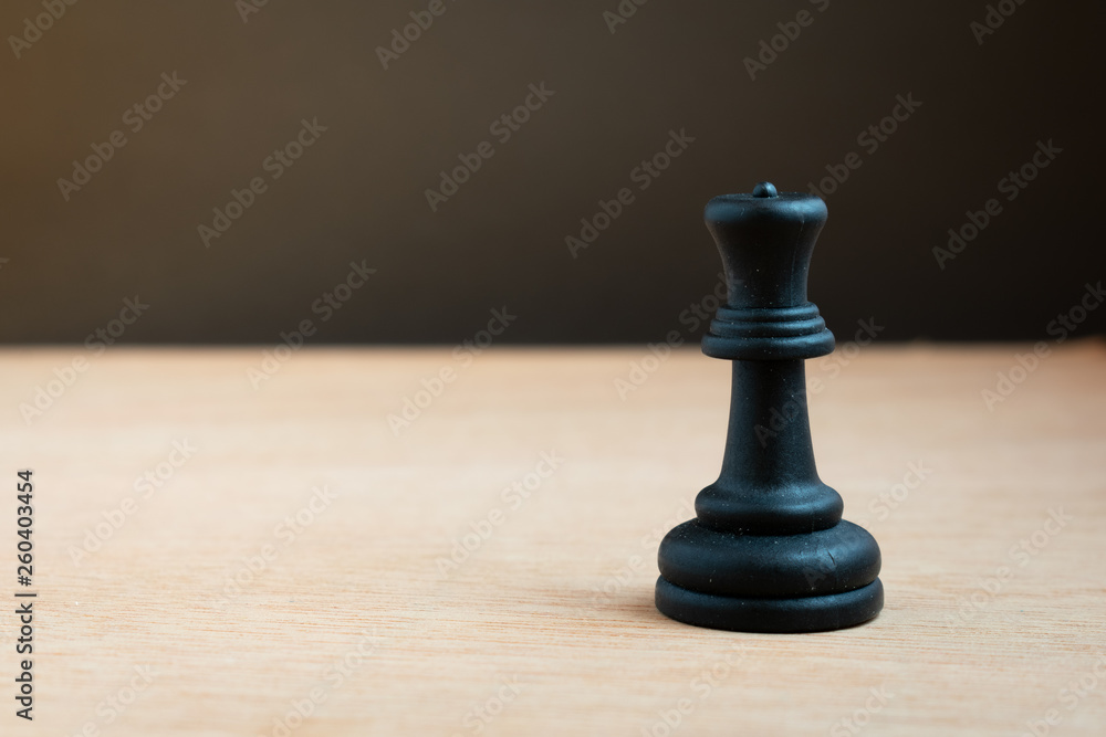 Black chess queen with black background Black chess queen with black background