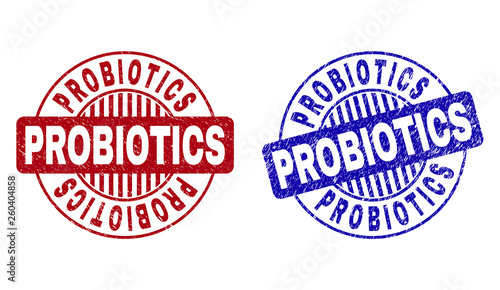 Grunge PROBIOTICS round stamp seals isolated on a white background. Round seals with grunge texture in red and blue colors. Vector rubber imprint of PROBIOTICS text inside circle form with stripes.