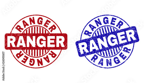 Grunge RANGER round stamp seals isolated on a white background. Round seals with grunge texture in red and blue colors. Vector rubber overlay of RANGER text inside circle form with stripes.