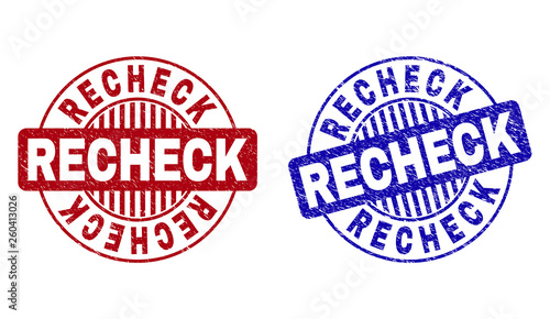 Grunge RECHECK round stamp seals isolated on a white background. Round seals with distress texture in red and blue colors. Vector rubber imprint of RECHECK label inside circle form with stripes.